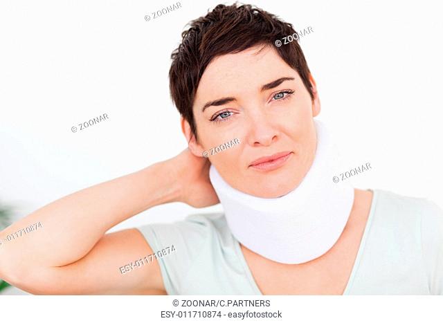 Close up of a woman with a surgical collar