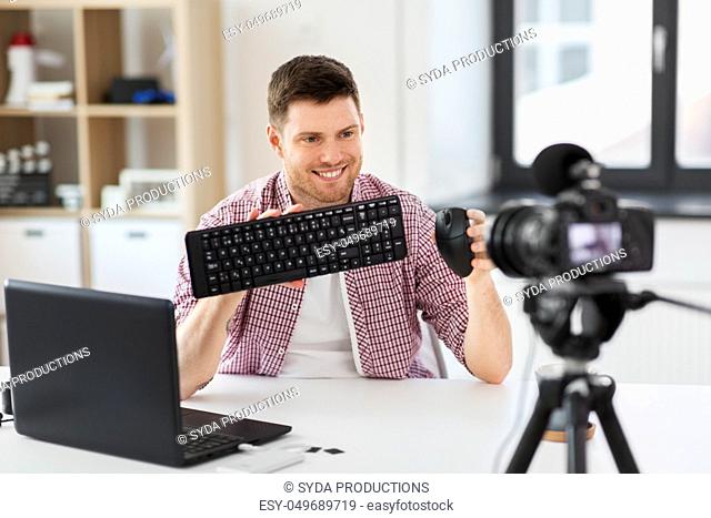 video blogger with keyboard and computer mouse