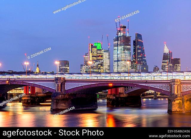 London Skylines building with river thames sunset twilight in London UK