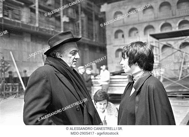 Italian director Federico Fellini talking to American actress and singer Liza Minnelli on the set of the film Fellini's Casanova. Rome, 1976