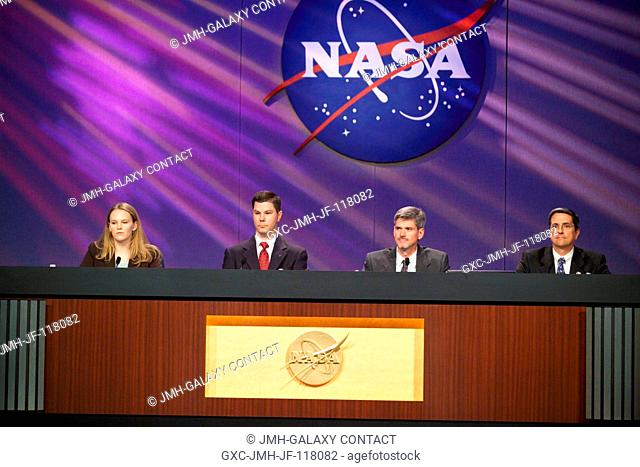 Kevin Engelbert (second left), Deputy Expedition 11 Increment Manager; Bryan Lunney, Expedition 11 Flight Director; and Dr