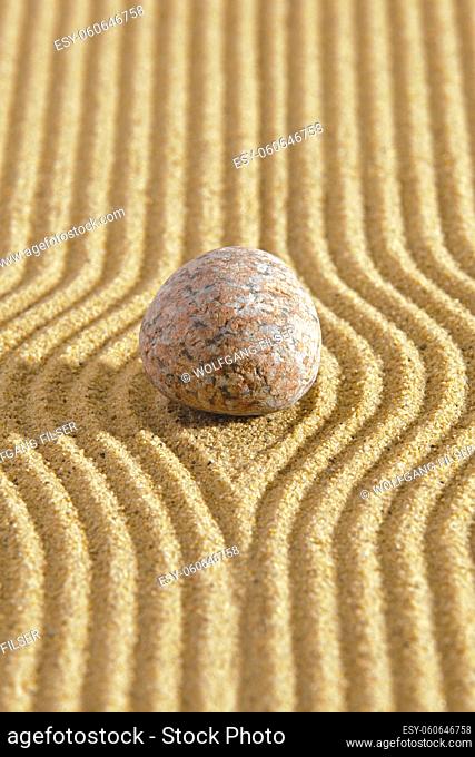 Japanese ZEN garden with stone in textured sand