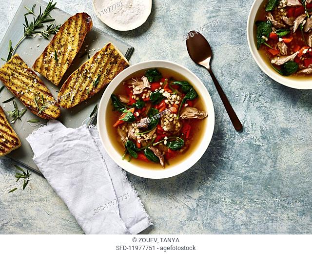 Lamb soup with barley, rosemary and bruschetta