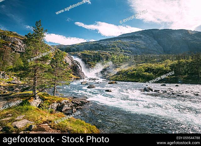 Kinsarvik, Hordaland, Norway. Waterfall Nykkjesoyfossen In Hardangervidda Mountain Plateau. Summer Sunny Day. Height Of 49 m