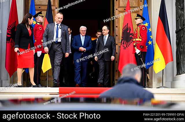 01 December 2022, Albania, Tirana: German President Frank-Walter Steinmeier (center, l) arrives with Bajram Begaj (center, r), President of Albania