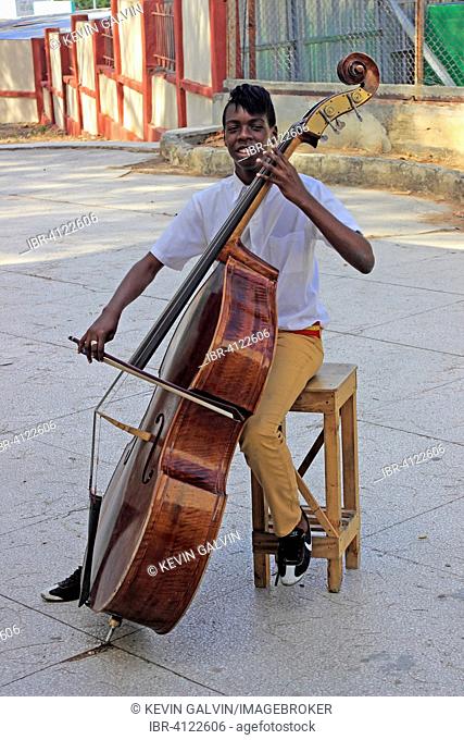 Music student playing the bass, Benny More School of the Arts, Cienfuegos, Cuba