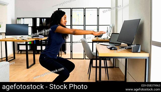 African Businesswoman Doing Sport Exercise Workout In Office