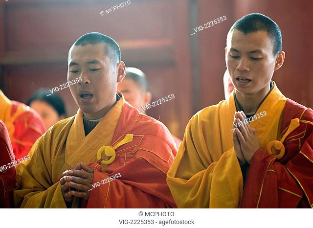 China, Zhenjiang. Buddhist monks in the Jinshan (Golden Hill) Temple. - 01/01/2010