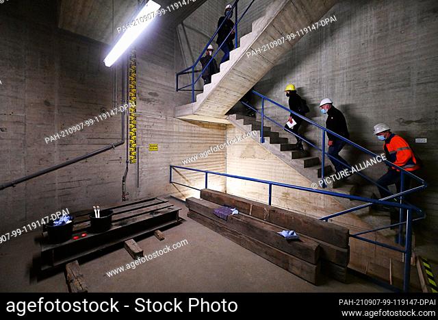 01 September 2021, Hessen, Edertal: Employees of the dam supervisory authority walk through the intake structure of the upper reservoir of pumped storage power...