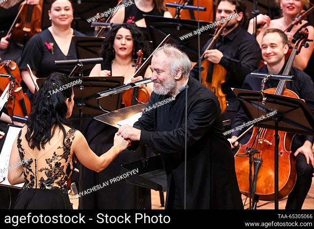 RUSSIA, MOSCOW - NOVEMBER 28, 2023: Mariinsky Theatre general and artistic director, conductor Valery Gergiev (C) and musicians of the Russian National Youth...