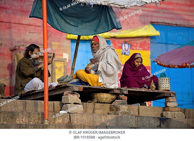 Men at the Ghats or holy stairs, Ganges, Varanasi, Uttar Pradesh, India, Asia