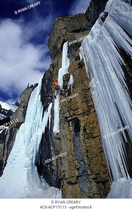 An iceclimber making his way up the Translucent Moron on the Icefields Parkway, Alberta, Canada
