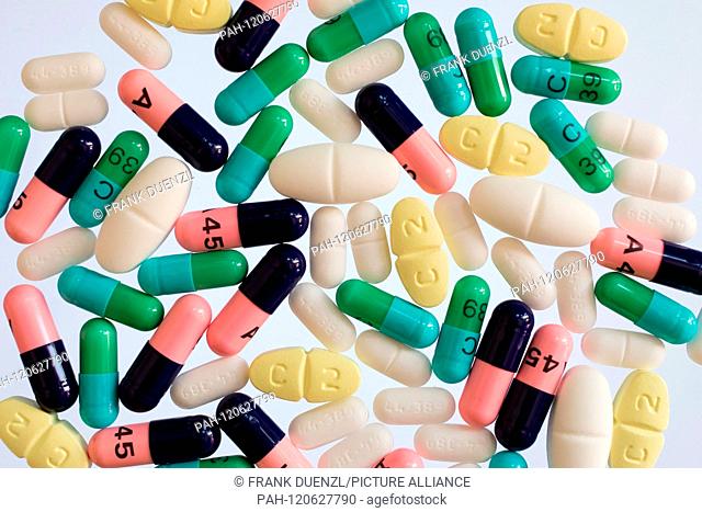 Clindamycin Capsules (green), Clarithromycin coated tablets, Ibuprofen and Amoxicillin Capsules on a white background, in November 2018