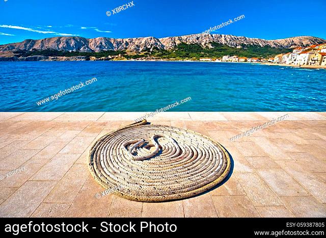 Boat rope on Stone pier by the sea, Island of Krk, Croatia