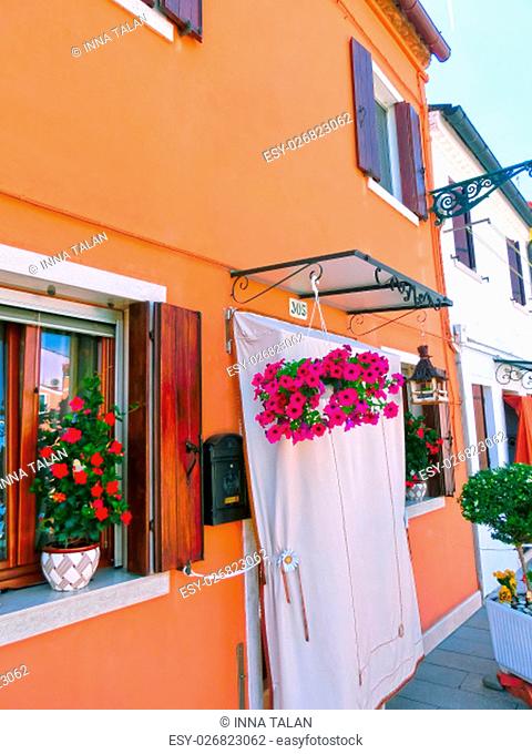 Burano, Venice, Italy - May 10, 2014: Colorful old houses on the Island of Burano near Venice, Italy