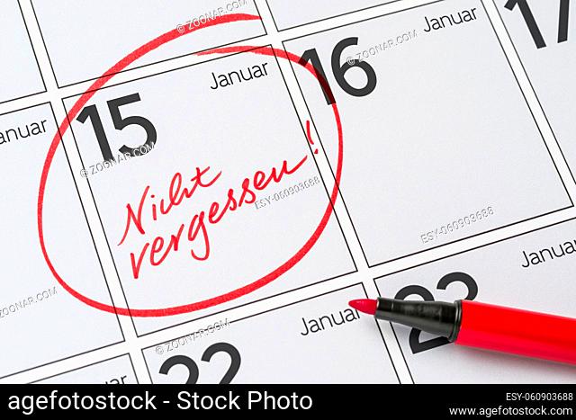 Save the Date written on a calendar - January 15 - Nicht vergessen in german