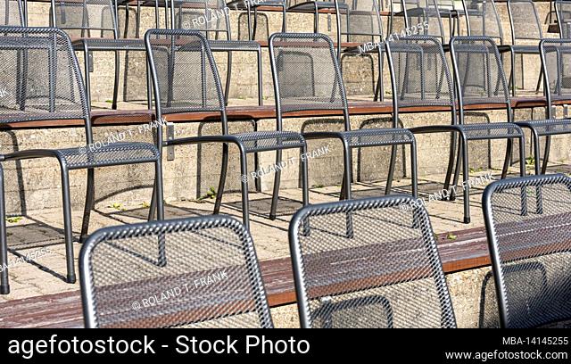 empty chairs in front of a stage