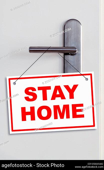closed door with an stay home sign