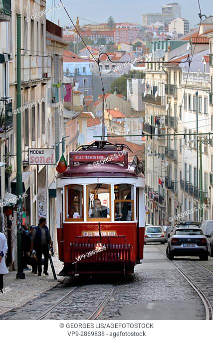 red vintage tramway streetcar Alfama street Lisbon Portugal