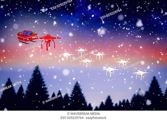 Composite image of high angle view of mini drone pulling chirstmas sledge