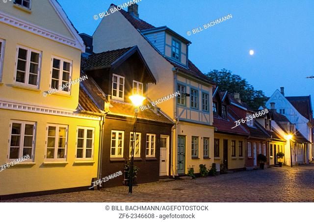 Odense Denmark beautiful old row homes cobblestone streets at twilight siunset night exposure in Hans Christian Andersen birthplace home