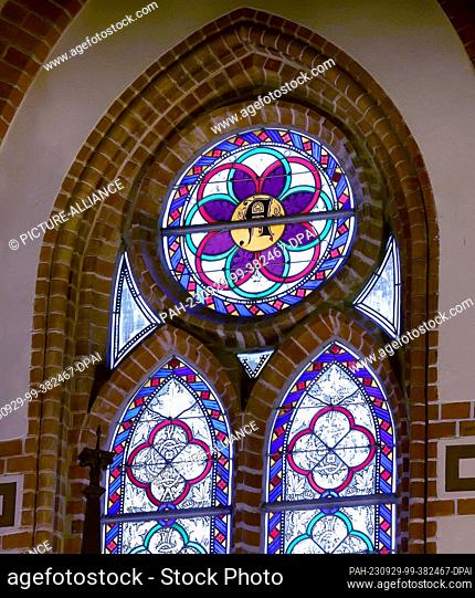 29 September 2023, Mecklenburg-Western Pomerania, Wustrow: A window in the Fischland Church of the Evangelical Lutheran Parish