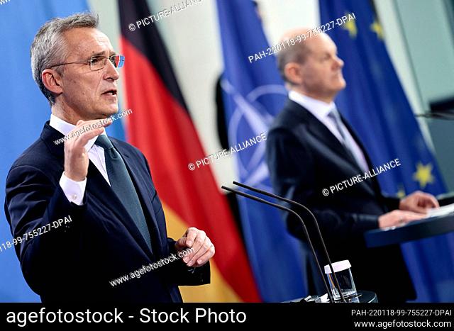 18 January 2022, Berlin: Jens Stoltenberg (l), NATO Secretary General, speaks during a press conference with German Chancellor Olaf Scholz (SPD) after their...