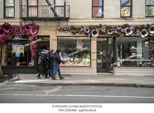 Stores on trendy Bleecker Street in the Greenwich Village neighborhood of New York seen decorated for the holidays on Tuesday, December 25, 2018