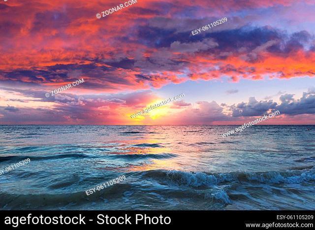 Beautiful cloudscape over the sea at sunrise. Holiday and travel natural background