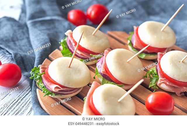 Mini cheese and prosciutto sandwiches