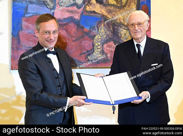 31 May 2022, Bavaria, Munich: Achim Budde (l), director of the ""Catholic Academy in Bavaria, "" and the honored Duke Franz of Bavaria stand on stage at the...