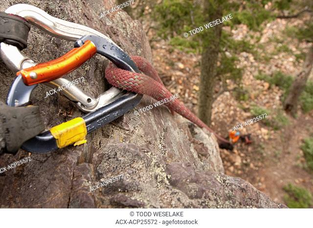 Carabiner support a rope for rock climbing outside Invermere B.C