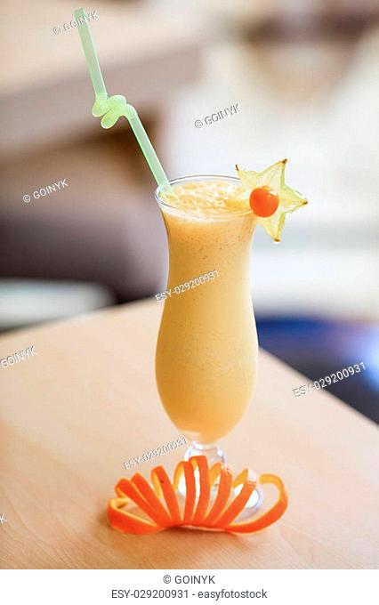 Milk cocktail with orange and carom