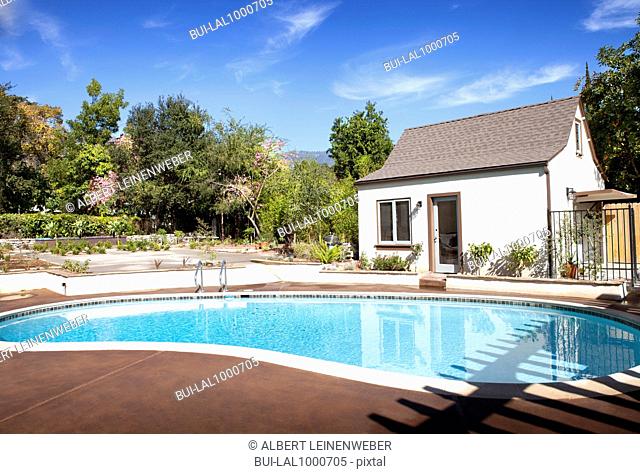 In ground pool in cottage backyard, Pasadena, California, USA