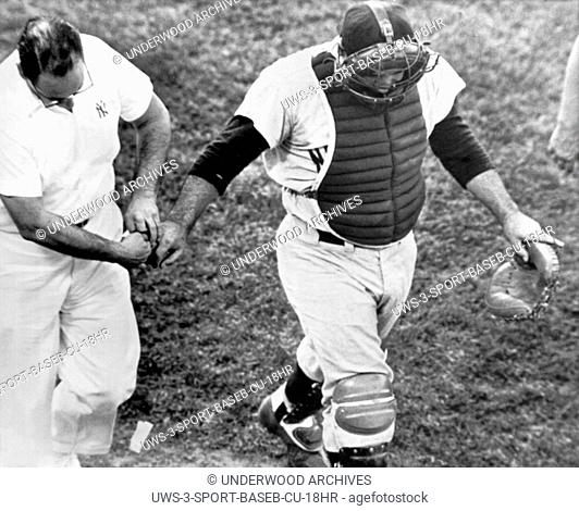 Baltimore, Maryland: August 24, 1962 New York Yankee catcher Yogi Berra trudges from the field after a foul tip off the bat of Marv Breeding ripped off a finger...
