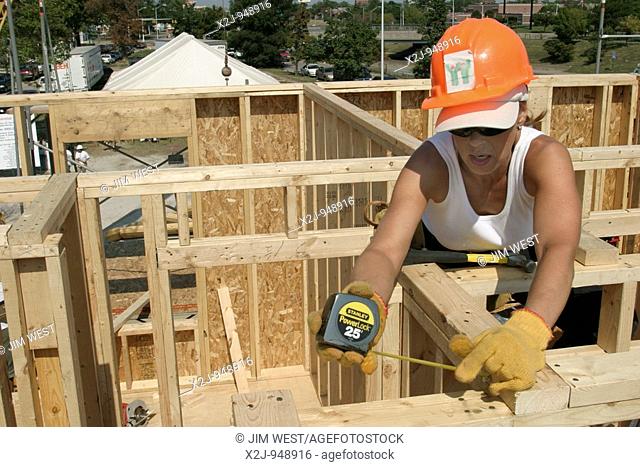 Detroit, Michigan - Volunteers with Habitat for Humanity transformed an entire city block on the west side of Detroit in the organization's 'Blitz Build '03 '...