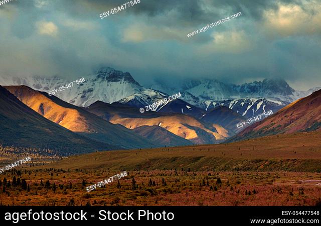 Picturesque Mountains of Alaska in summer. Snow covered massifs, glaciers and rocky peaks