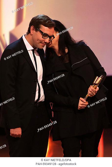 US internet activist Jacob Appelbaum (l-r) and US director Laura Poitras receive the award for 'best documentary' for their film 'Citizenfour'