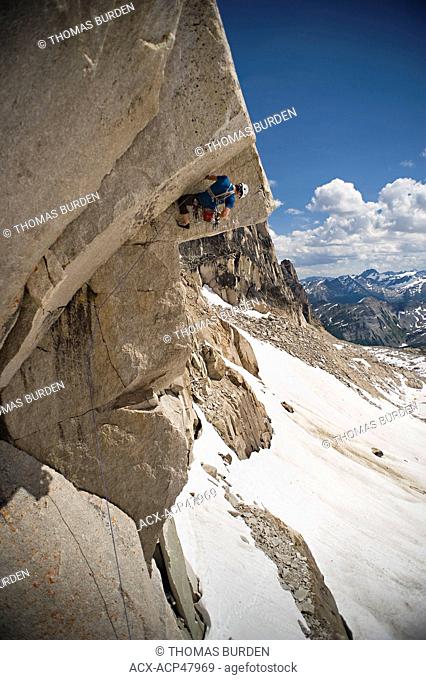Trad Climber on McTech Roof, Crescent Spire, Bugaboos Provincial Park, East Kootenay’s British Columbia, Canada
