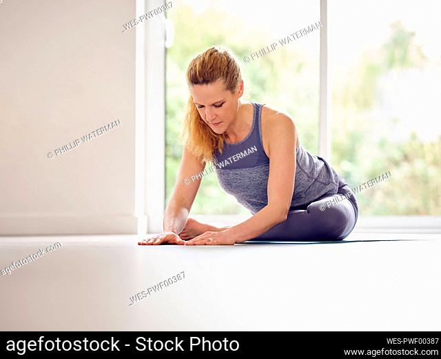 Active woman exercising at home