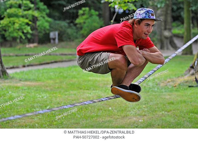 The world slackline champion of 2012, Lukas Huber from Brixen, shows his skills at Fort Koenigstein in Dresden, Germany, 31 July 2014