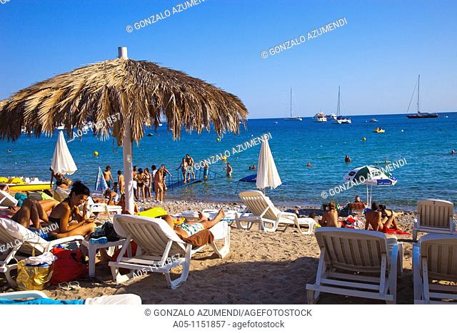 Group of people on the beach.Tropicana Bar. Jondal Beach. Sant Josep de sa Talaia. Ibiza. Balearic Islands. Spain