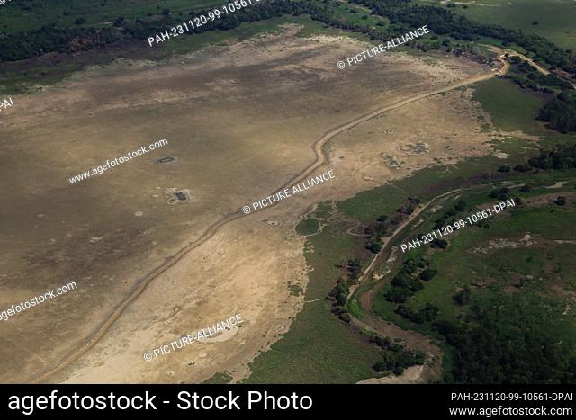 PRODUCTION - 08 November 2023, Brazil, Parintins: View of dried out areas of the Amazon community. The green lung of the planet is experiencing an unprecedented...