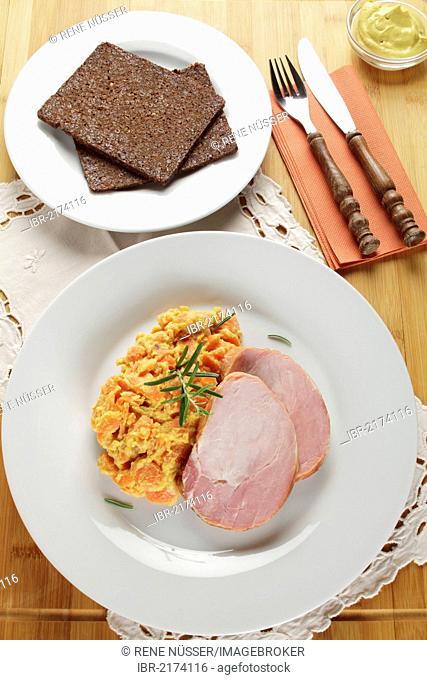 Smoked pork roast, gammon, Kassel-style pork, with carrots, brown bread and mustard