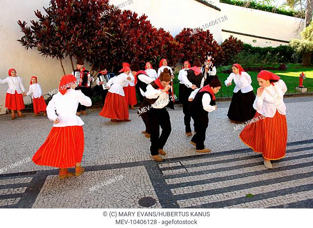 Dancers belonging to a folklore group from Campanario, performing an old dance in the street in Funchal, the capital city of Madeira