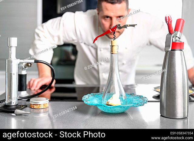 Concentrated at work. Portrait of professional chef working in restaurant kitchen. High quality photo