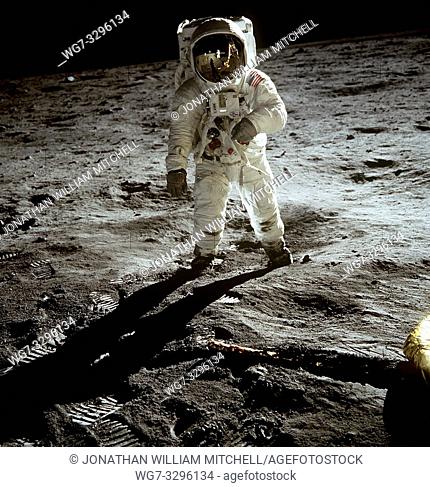 EARTH, THE MOON, Sea of Tranquility -- 20 Jul 1969 -- Astronaut Edwin E Aldrin Jr, lunar module pilot, walks on the surface of the Moon near the leg of the...