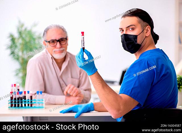 Old patient visiting young doctor in blood sampling concept