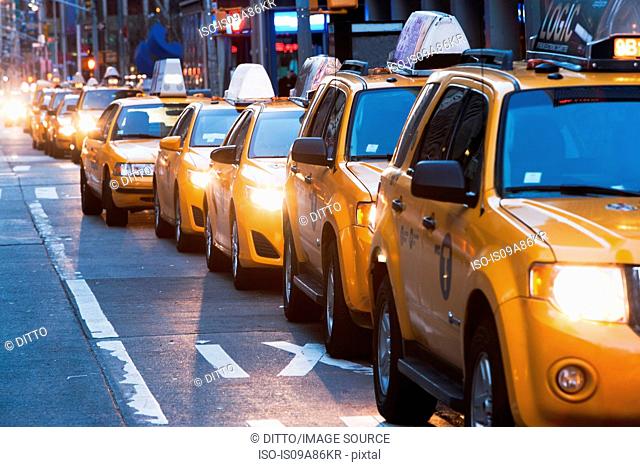 Queue of yellow taxis, New York City, USA