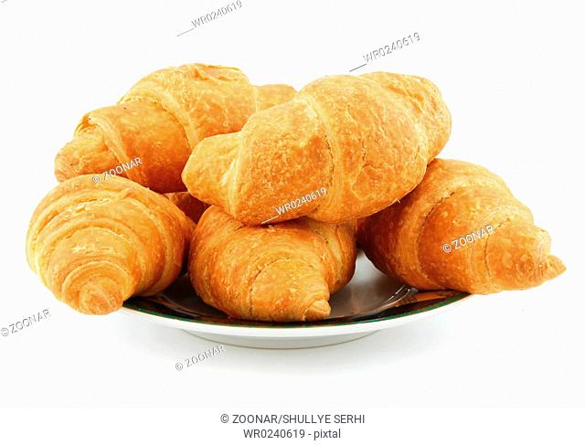 Group of Croissants on Saucer Isolated on White